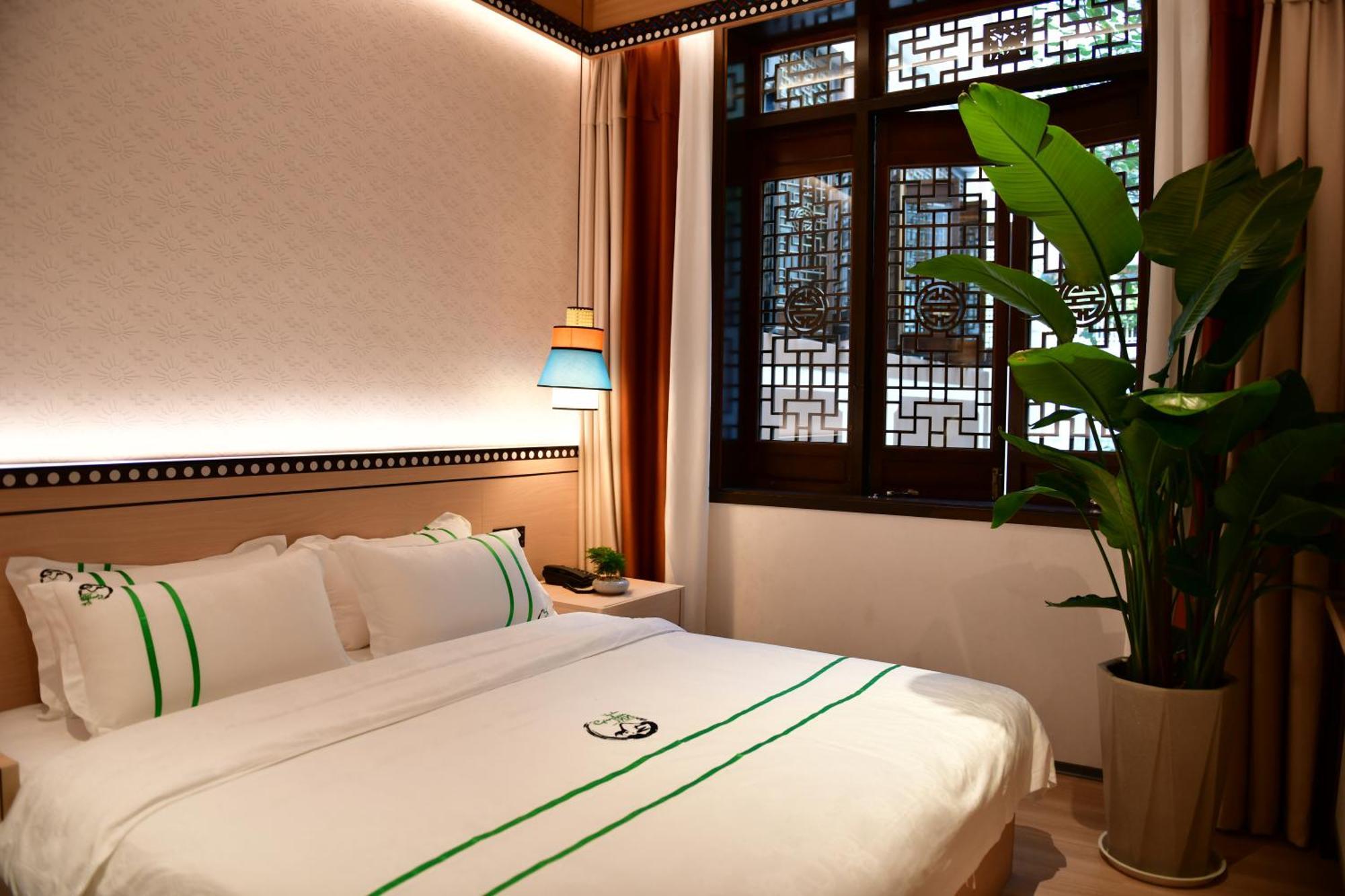 Xishu Garden Inn - Travel Agency Service - Car Rent Service - English Speaking Csengtu Kültér fotó